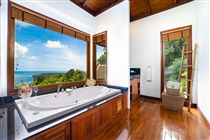 Master bedroom ensuite bathroom with stunning sea view